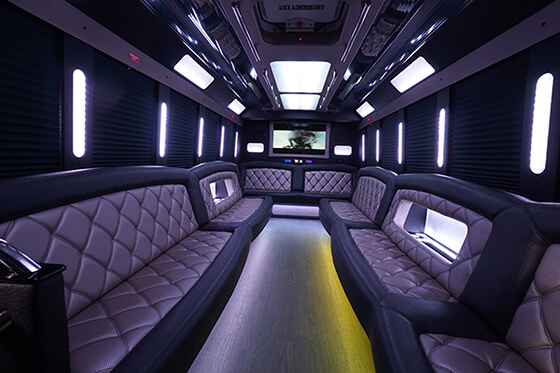 Party bus rental with leather chairs